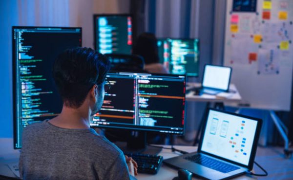 asian and Indian Developer  devops team working  about coding promgram with software computer at night in office